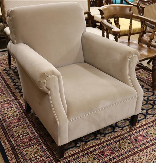 A modern pale beige fabric armchair